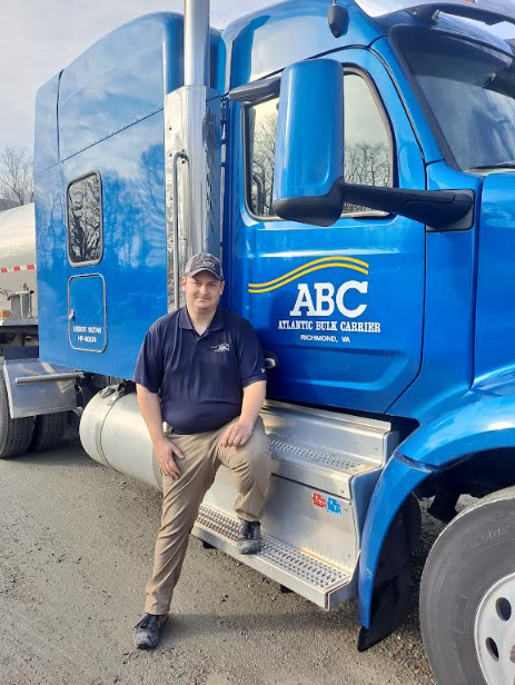 picture of Alexander Hannett in front of his tractor trailer after earning his CDL at Laurel Ridge in 2022